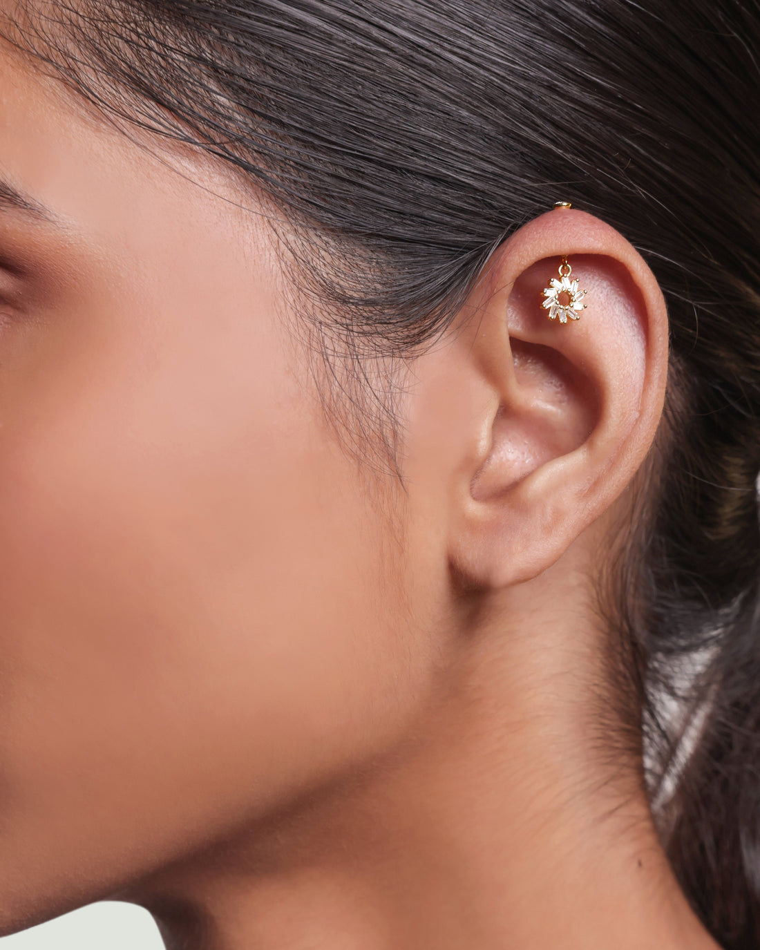 Baguette Rays Helix 14K Gold Earrings featuring a modern circle design with clear baguette stones, ideal for helix piercings and elegant styling.