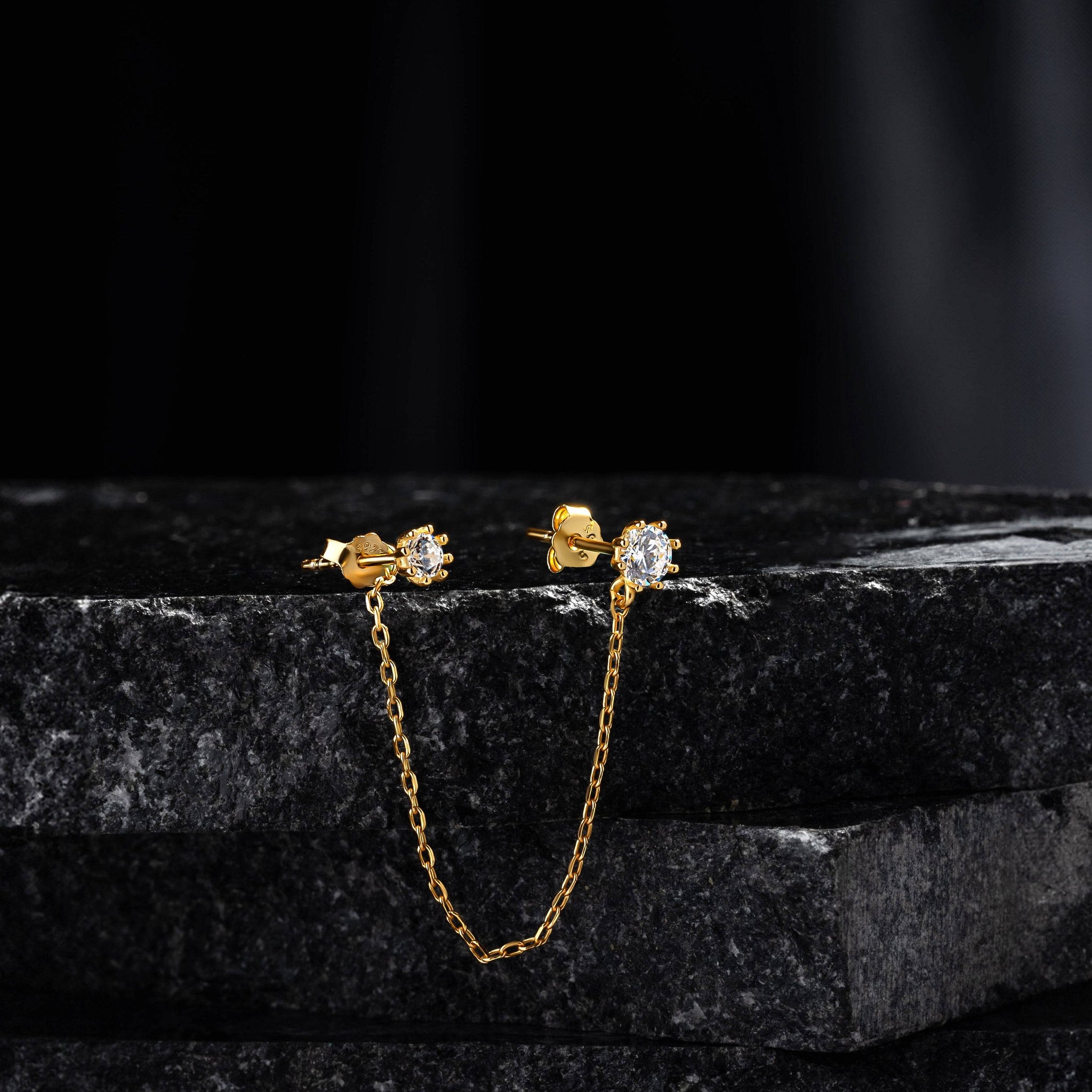Solitaire Chain Connector - 3-in-1 stud featuring a gold chain linking two solitaire studs, ideal for helix or lobe styling in fine jewelry.