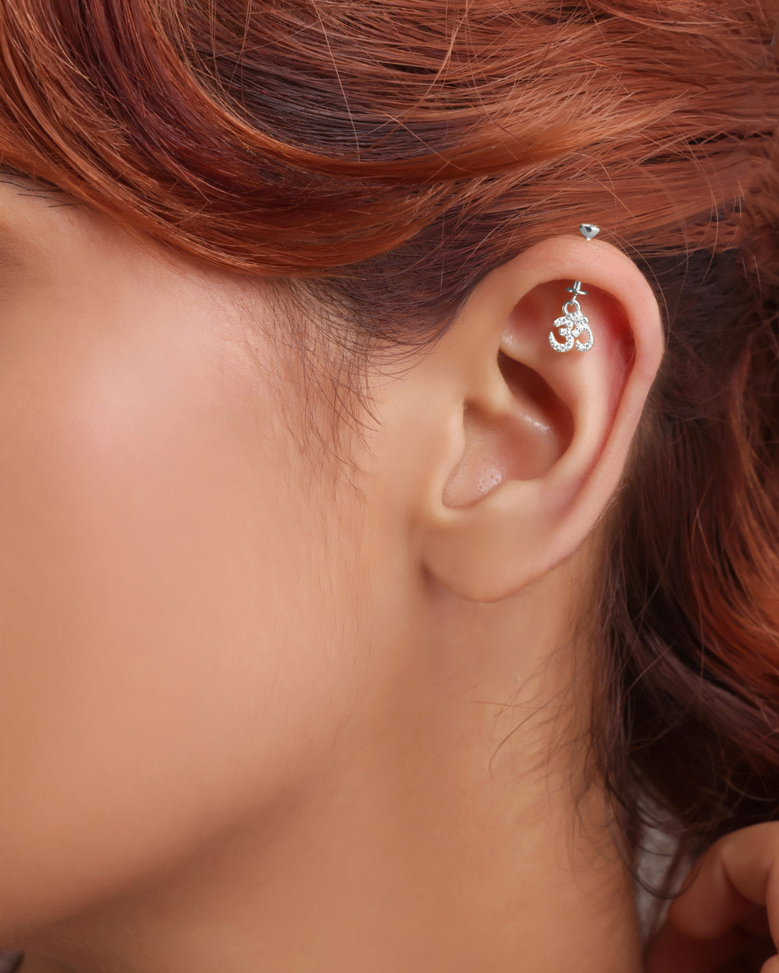 Silver AUM Helix Hanging Jewelry featuring a fine screw design and shimmering stones, ideal for a serene, symbolic ear accessory.