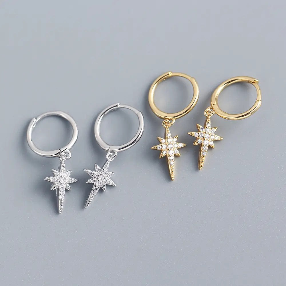 "Long Star Hoop Earrings on Display - Celestial-Inspired Jewelry Showcase"