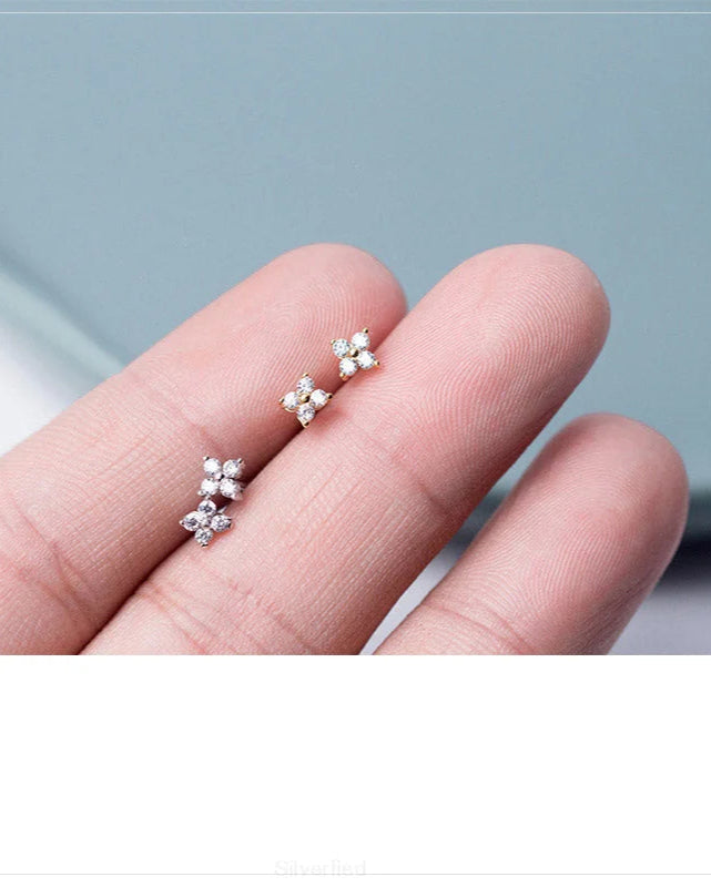"Sterling Silver Lotus Stud Earring Held in Hand"